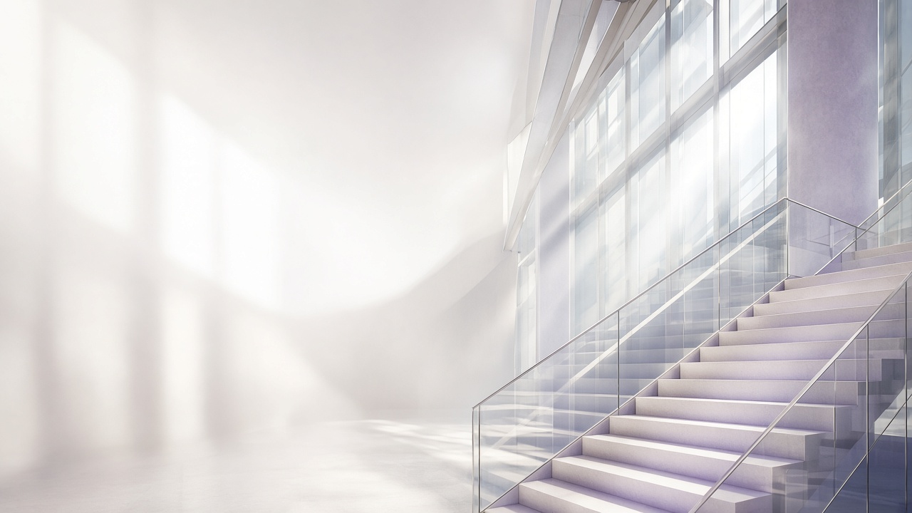A bright staircase inside a glass-walled office building